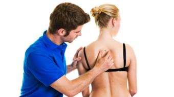 examining skin on back