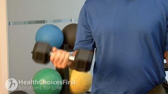 Jackson Sayers, B.Sc. (Kinesiology), discusses standing bicep curls strength exercises.
