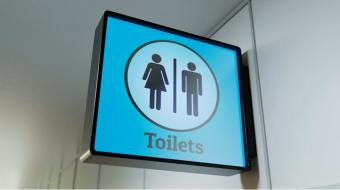woman man washroom sign